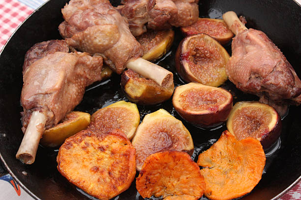Confit of duck sleeves confit of duck sleeves with figs and sweet potato  confit stock pictures, royalty-free photos & images
