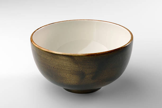 istock Rustic brown chinese bowl isolated on white background 619374034