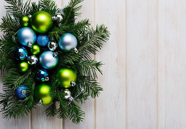 istock Christmas background with green, blue and silver ornaments 619375736