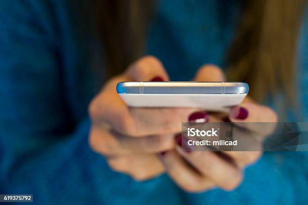 Teenage Girl Texting On Her Mobile Phone Stock Photo - Download Image Now - Phone Message, Addiction, Accessibility