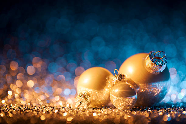 istock Christmas ornaments on defocused lights. Decorations Bokeh Blue Gold 619376328