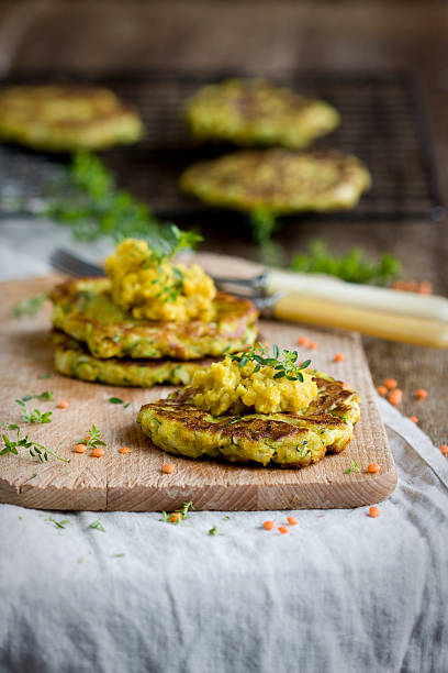 Vegan zucchini burgers with red lentil paste stock photo