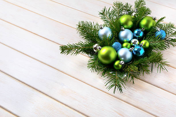 istock Christmas table centerpiece with light blue and green ornaments 619379032