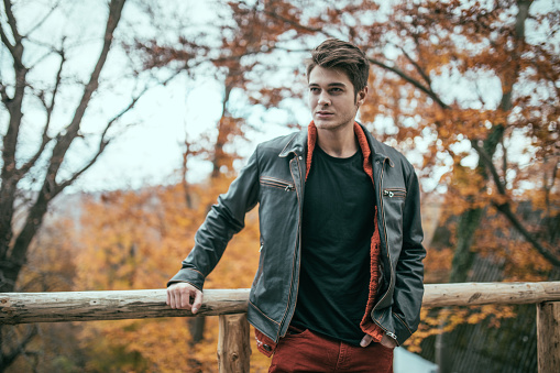Good looking young man outdoors on a beautiful autumn day.