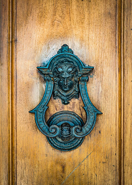 istock Door knoker on an old wodden door 619386932