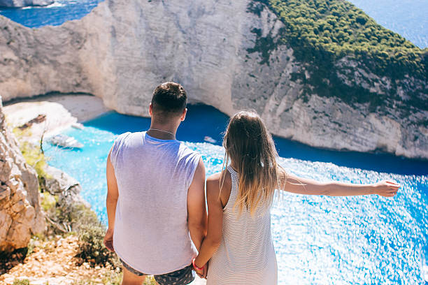 istock Travelers on the Background Incredible Navagio Beach 619387264