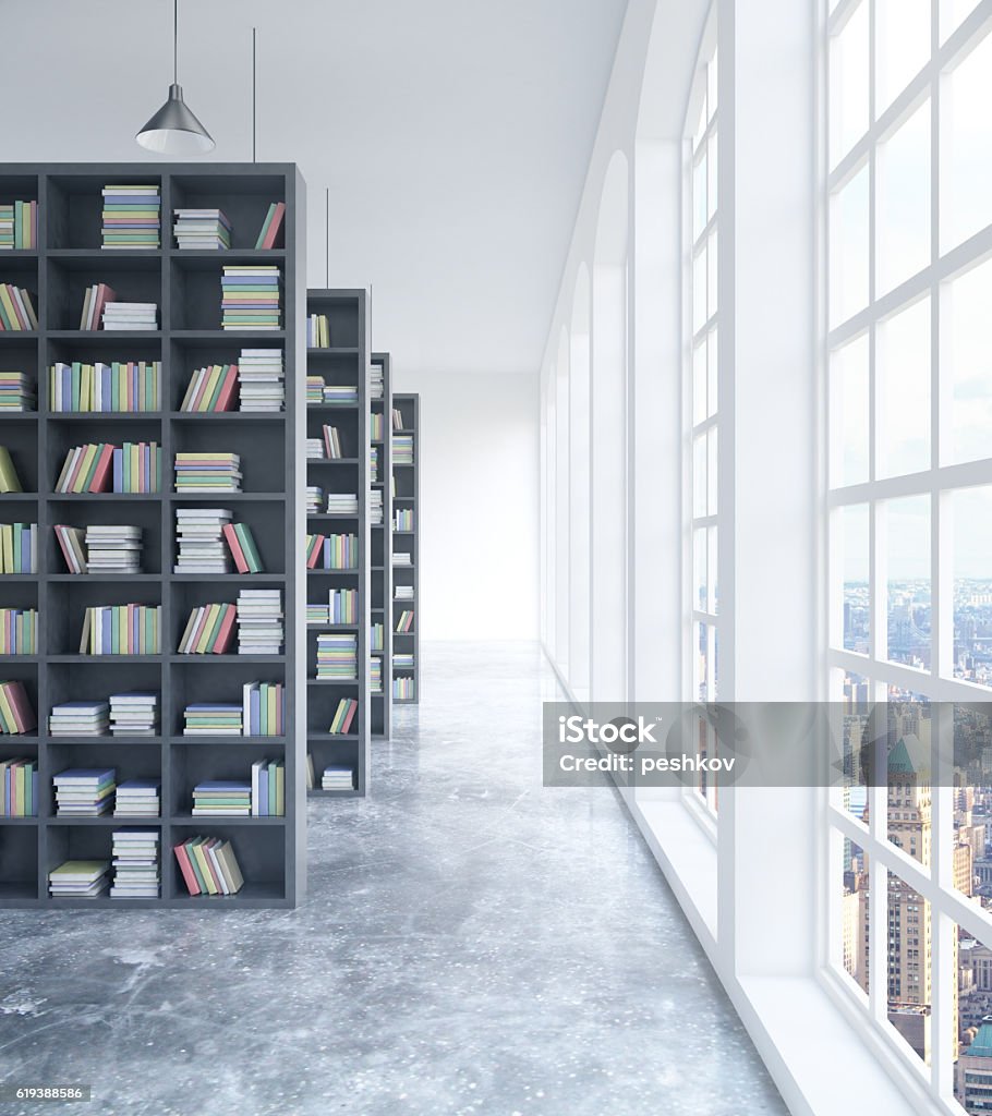 Library with city view Modern concrete library interior with book shelves, daylight and city view. 3D Rendering Apartment Stock Photo