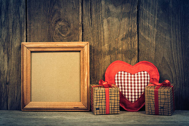 istock Box with gifts on wooden background. 619389828