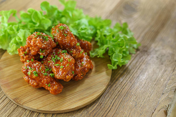 istock Crispy fried chicken wings with barbecue sauce. 619389968
