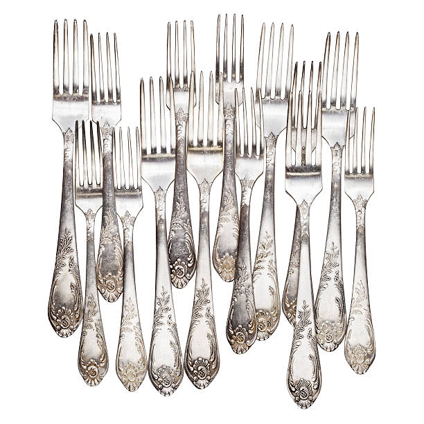 istock Aged vintage silver forks isolated on white 619391184