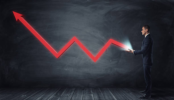istock Huge red line graph with an upturned arrow growing from 619393376