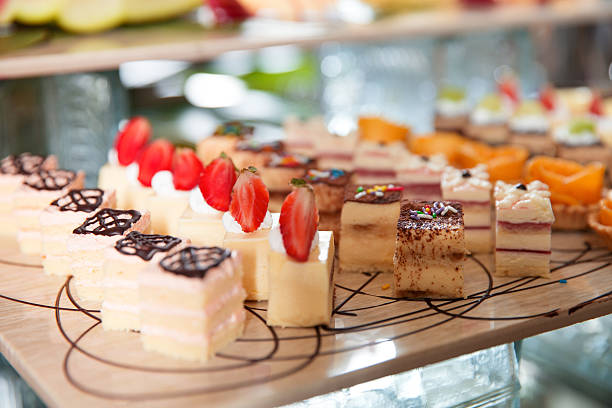 Delicious Mini Cakes on Buffet Table stock photo