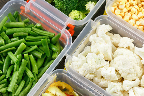 istock Trays with raw vegetables for freezing. 619396450