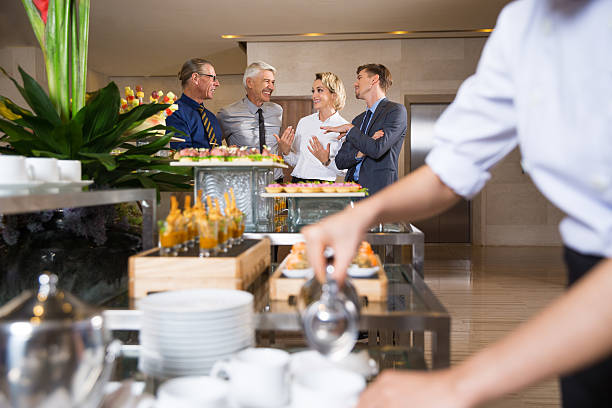 istock Cheerful Business People Talking in Buffet 619398196