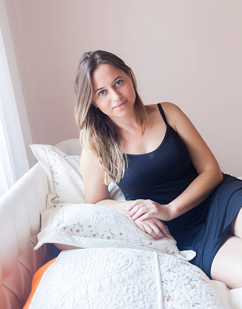 istock Relaxed woman on her bed 619399180