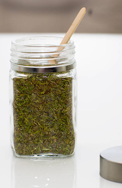 istock Herbs are in the glass jars with spoons. 619399322