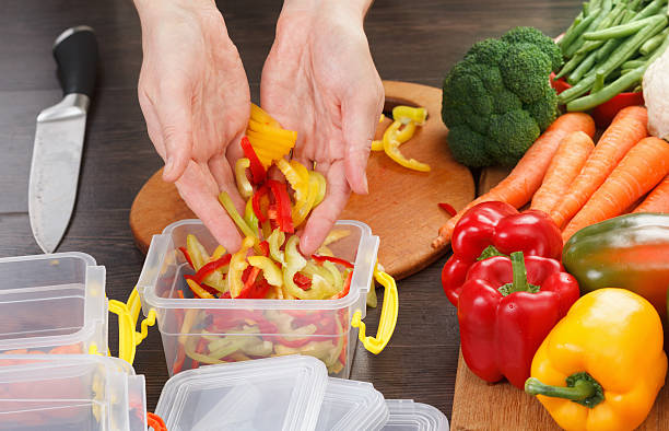 istock Chef cutting bell pepper for cooking. Stock up on winte 619400640