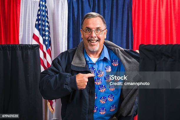 Man Committing Voter Fraud Exposes His Many I Voted Stickers Stock Photo - Download Image Now