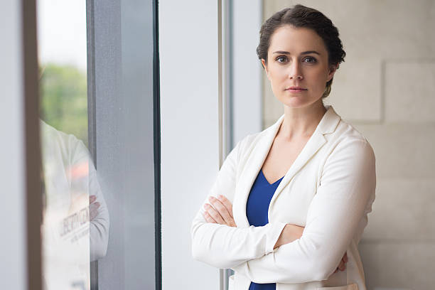 istock Confident Young Businesswoman with Folded Arms 619401288
