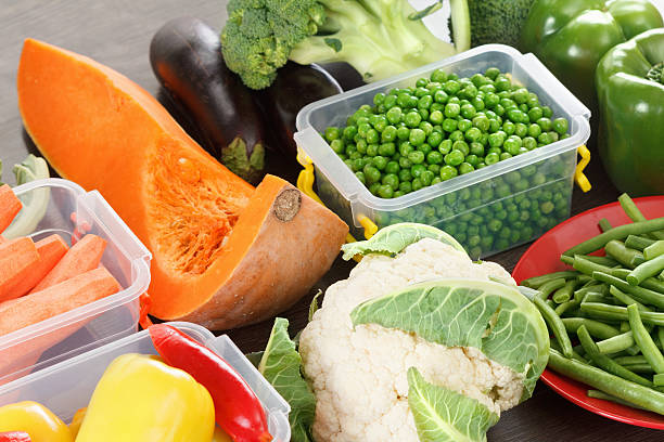 istock Trays with raw vegetables for freezing. 619401848