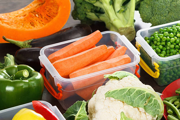 istock Trays with raw vegetables for freezing. 619401894