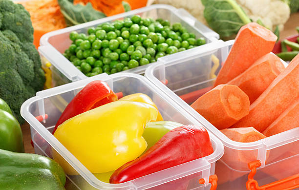 istock Trays with raw vegetables for freezing. 619401944