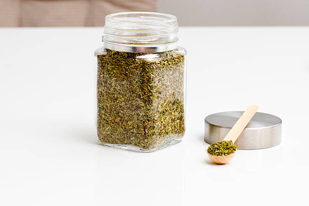 istock Herbs are in the glass jars with spoons. 619402270