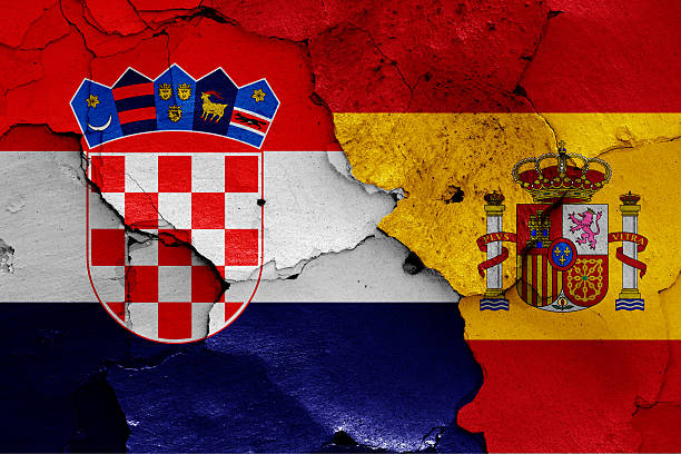 istock flags of Croatia and Spain painted on cracked wall 619402980