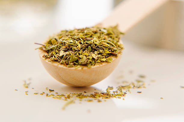istock Aromatic herbs are in the small spoon close-up. 619404262
