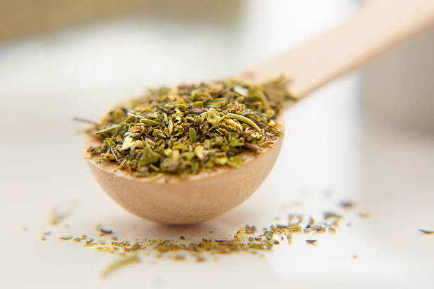 istock Aromatic herbs are in the small spoon close-up. 619404292