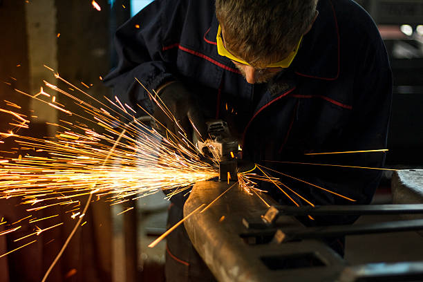 istock Metal sawing close up sparks spray. 619407006