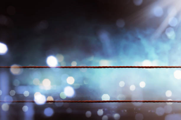 Boxing ring ropes Boxing ring ropes with a blur spotlight boxing stock pictures, royalty-free photos & images