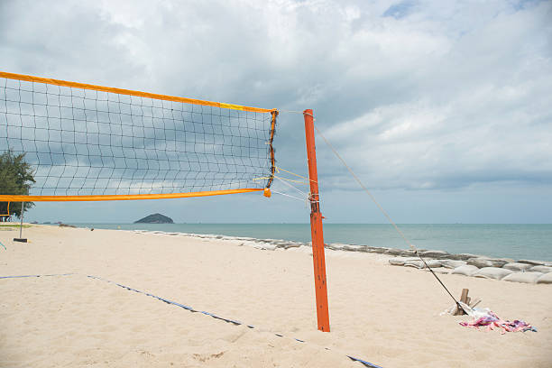 istock Beach Volleyball net on the beach with blue sky 619407122