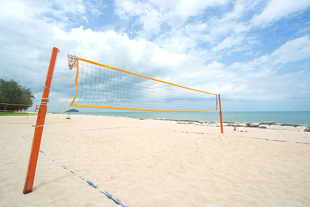 istock Beach Volleyball net on the beach with blue sky 619407176