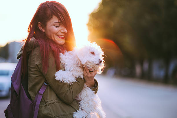 istock Beautiful Redheaded Girl Embracing Cute Dog 619407312