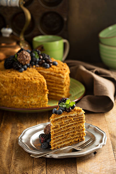 istock Caramel cake with honey and cream frosting 619408232