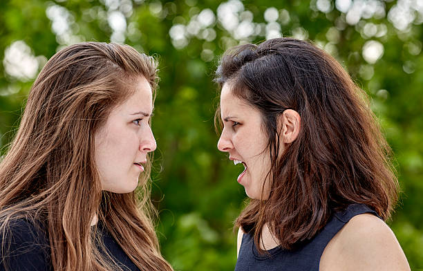 istock Two Girls having a Heated Arguement 619409360
