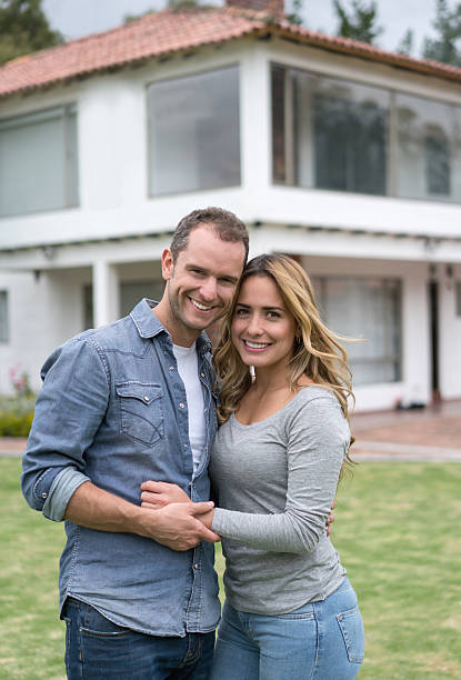 istock Loving couple outside their house 619410926