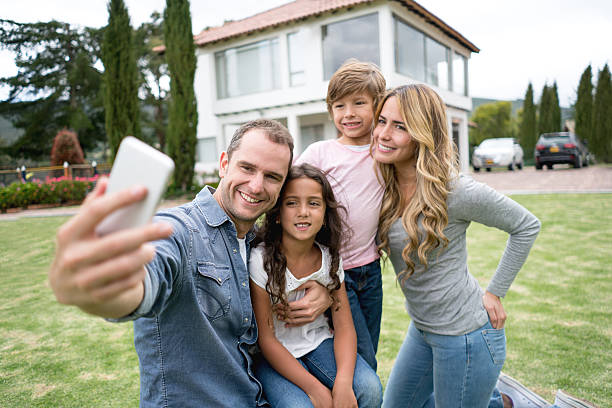 istock Family taking a selfie at the park 619410948
