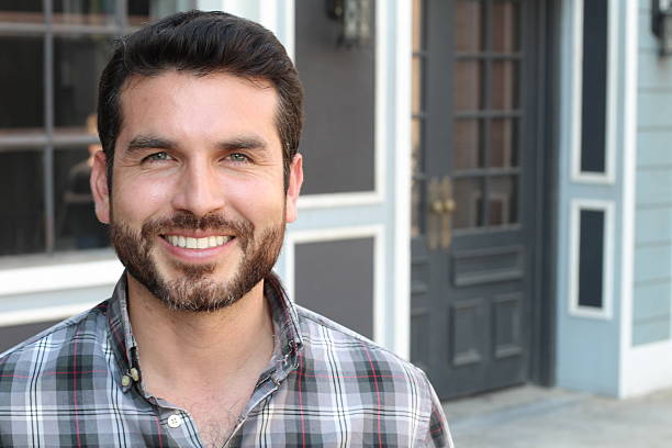 istock Portrait of happy young man smiling 619411066