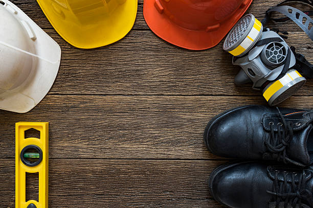 istock Safety equipment on old wooden table, top view 619411290