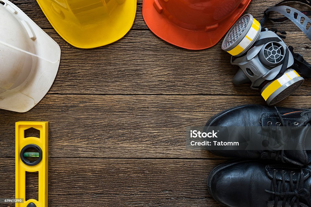Safety equipment on old wooden table, top view Working Stock Photo