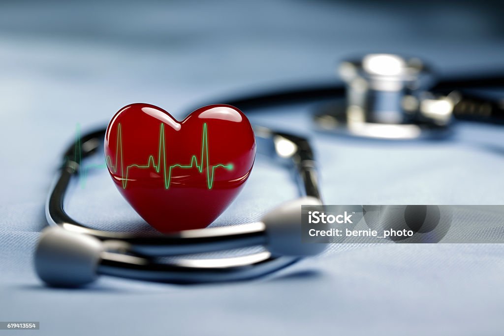 Heart Care and ECG Heart and a stethoscope with heartbeat (pulse) symbol in Light blue background Heart Shape Stock Photo