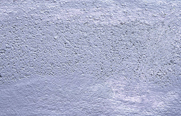 istock Purple paint on brick wall texture background 619499420
