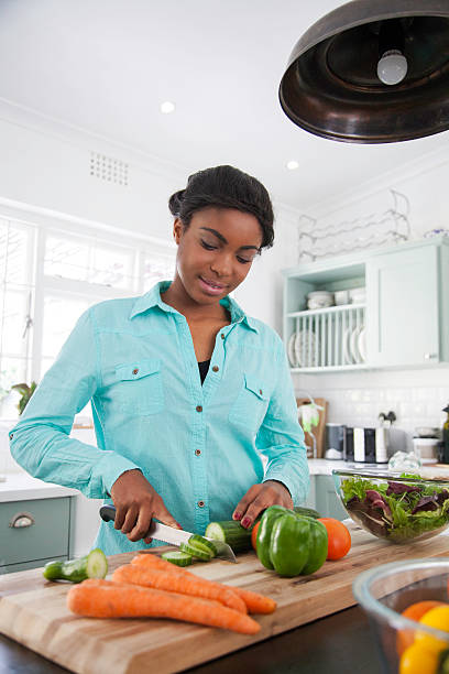 istock African female cooking up a storm. 619503762