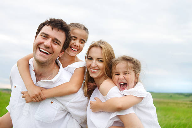 istock Happy young family with two children 619504252