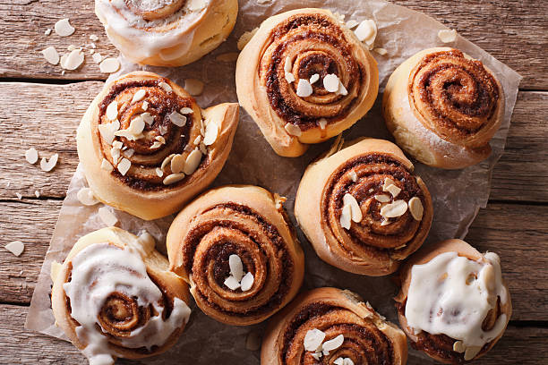 istock Glazed Cinnamon rolls with almond close up. horizontal top view 619507056