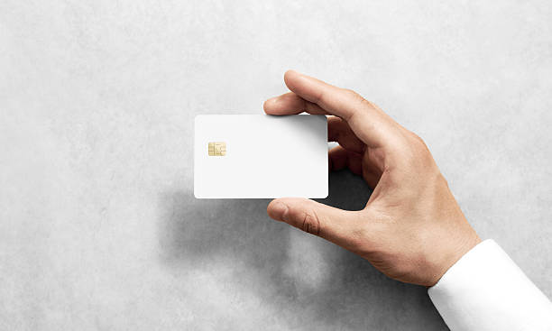 istock Hand holding blank white credit card mockup with rounded corners 619507456