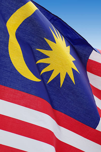 istock Malaysian flag against blue sky, fragment. 619508424
