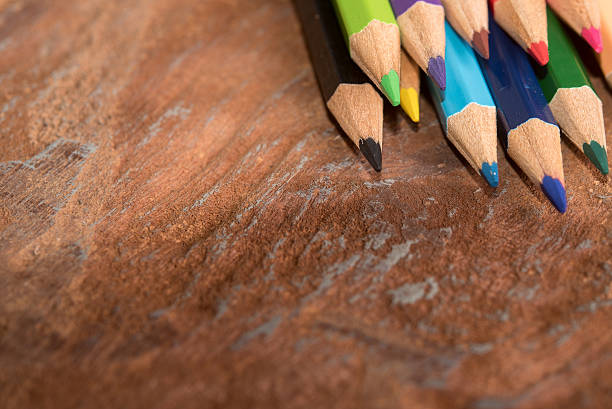 istock colorful pencils on wood table 619508646